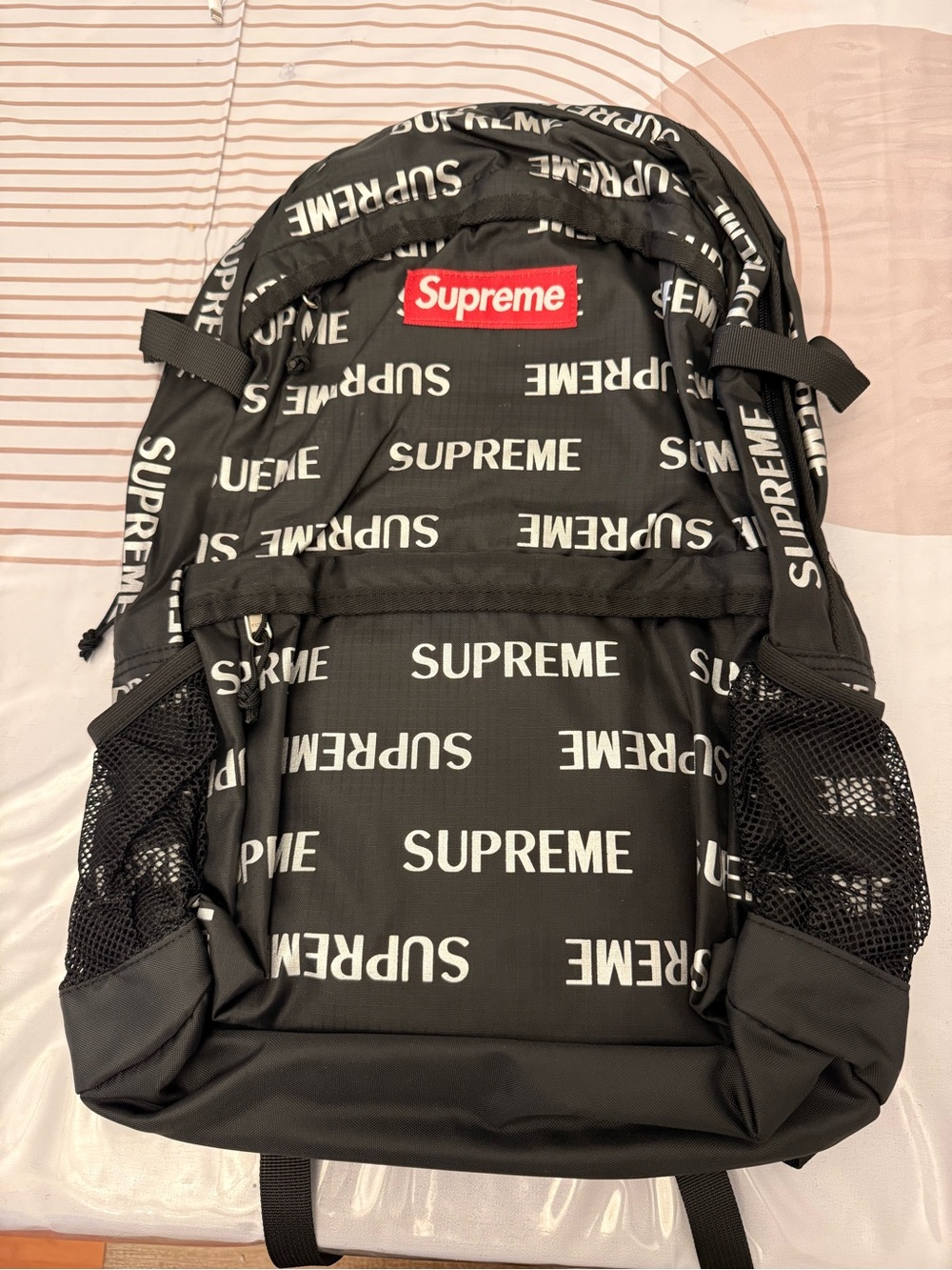Supreme Black Backpack with White All-Over Logo and Red Patch